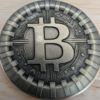 Coin engraved with a large Bitcoin B symbol