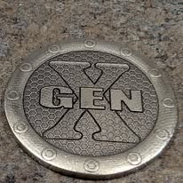 Coin engraved with a Generation X logo